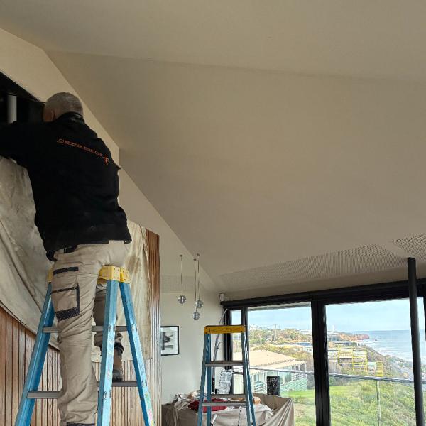 Clements Electrics electrician working in the iconic Pole House in Fairhaven on the Great Ocean Road